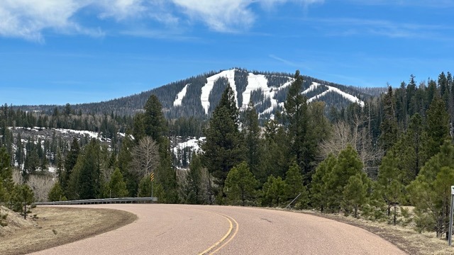 road with snowy mountain in background